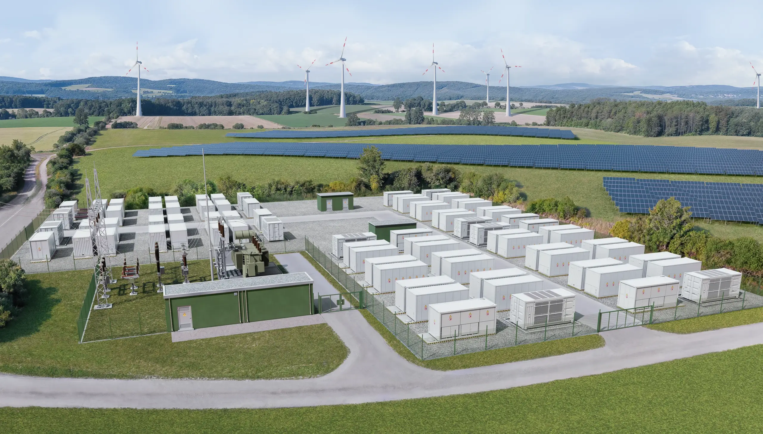 Luftaufnahme eines Batteriespeichers mit Umspannwerk, Batteriecontainern, Solarpark und Windkraftanlagen